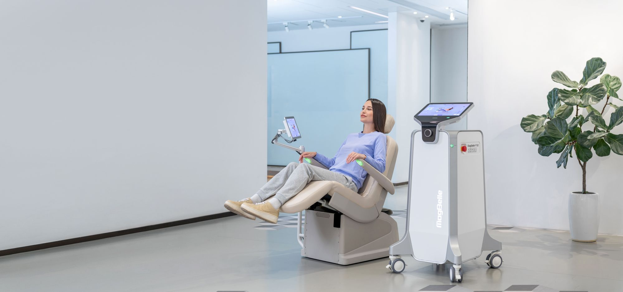 Patient seated comfortably during MagBelle pelvic floor muscle stimulation session